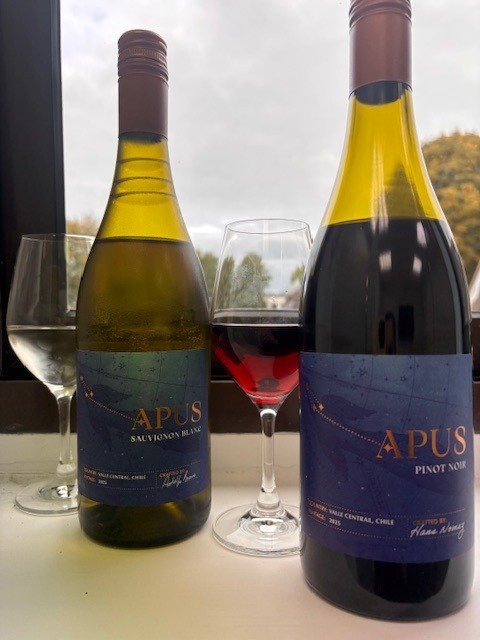 Apus Sauvignon Blanc and Apus Pinot Noir bottles with a glass of each poured