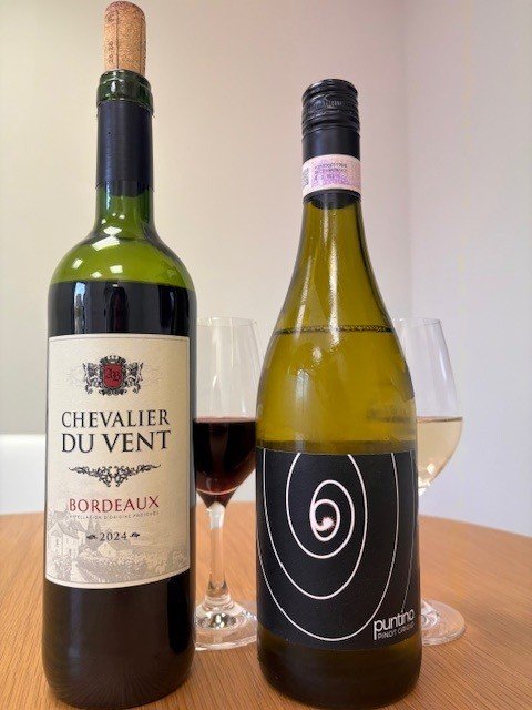 Chevalier du Vent Bordeaux 2024 and Puntino Pinot Grigio bottles with a glass of each poured