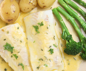 Halibut with Butter and Herb Sauce served with Broccoli and Potatoes
